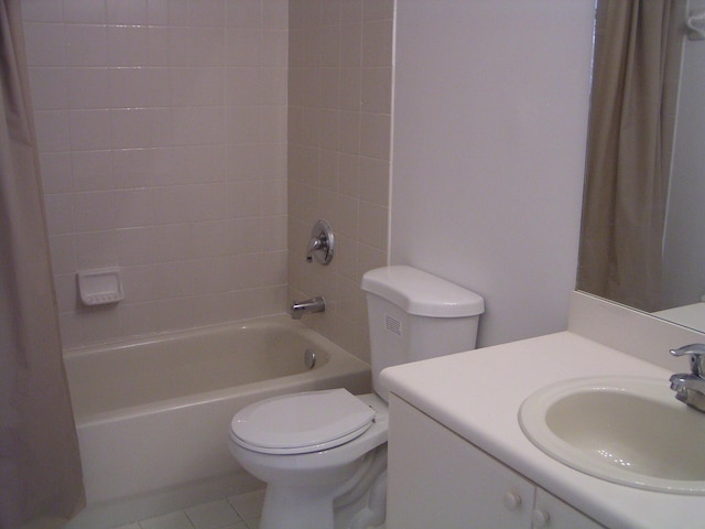 full bathroom with tile patterned floors, toilet, vanity, and shower / tub combination