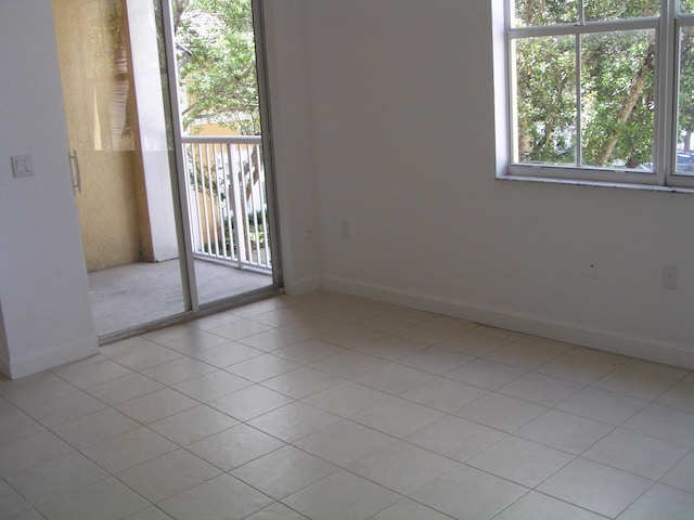 empty room with light tile patterned flooring