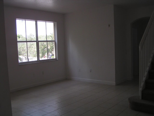 empty room with light tile patterned floors