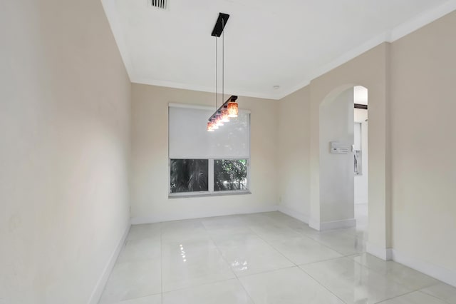 empty room featuring arched walkways, light tile patterned flooring, visible vents, baseboards, and ornamental molding