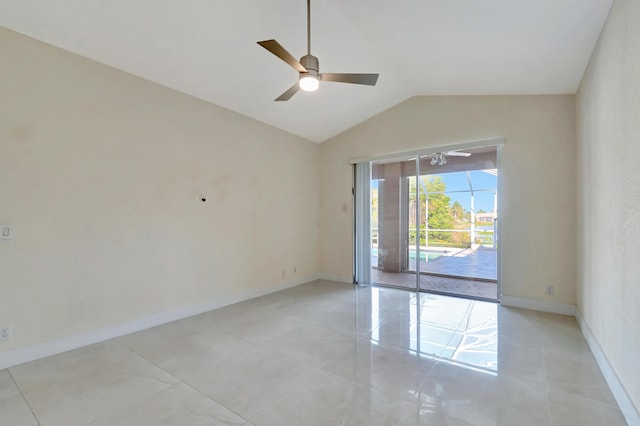 unfurnished room featuring baseboards, vaulted ceiling, and a ceiling fan