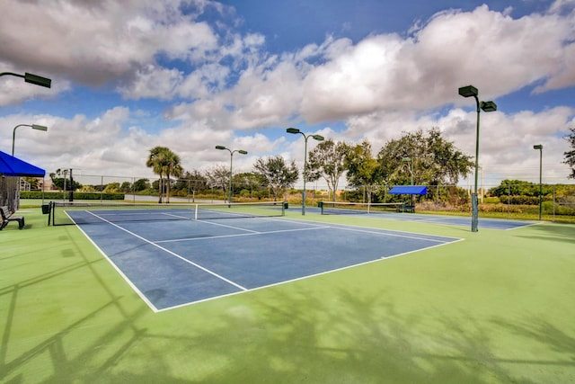 view of sport court with fence