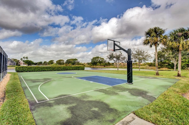 view of basketball court with community basketball court and fence