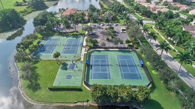 birds eye view of property with a water view