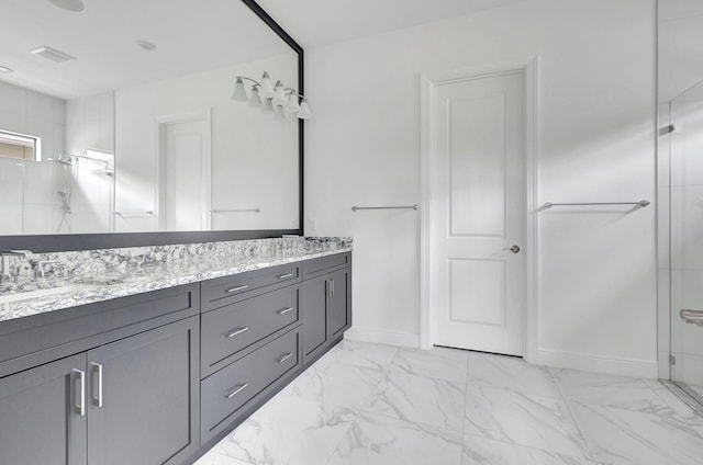 bathroom featuring a sink, marble finish floor, double vanity, and a stall shower