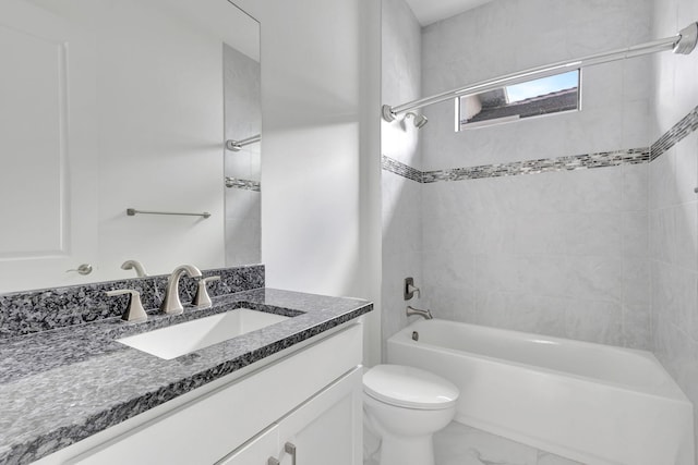 bathroom featuring vanity, marble finish floor, toilet, and shower / bathing tub combination