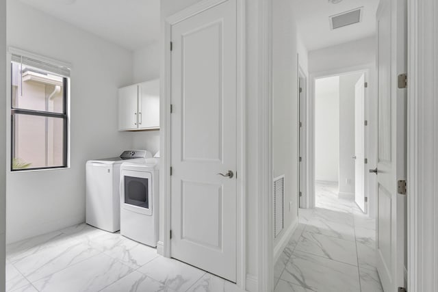 laundry room with marble finish floor, visible vents, cabinet space, and washer and dryer