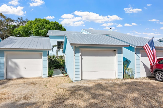 exterior space featuring an outdoor structure and a garage