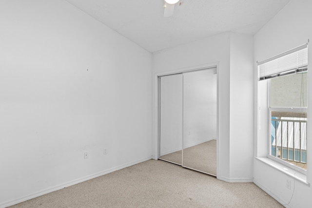 1820 SE Hideaway Cir Unit 1820, Port Saint Lucie, FL 34952 - unfurnished bedroom featuring a closet, a ceiling fan, and baseboards