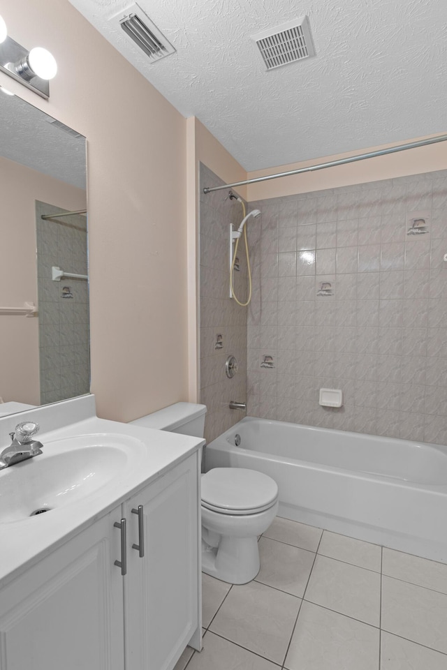 1820 SE Hideaway Cir Unit 1820, Port Saint Lucie, FL 34952 - bathroom featuring tile patterned flooring, visible vents, shower / tub combination, and vanity