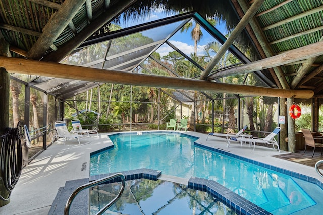 1820 SE Hideaway Cir Unit 1820, Port Saint Lucie, FL 34952 - view of swimming pool with a lanai, a pool with connected hot tub, and a patio area