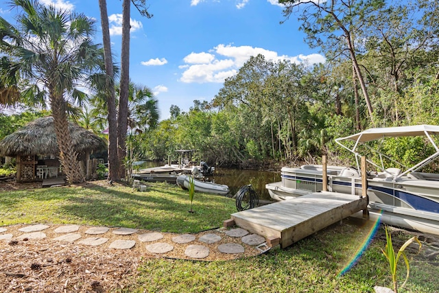 1820 SE Hideaway Cir Unit 1820, Port Saint Lucie, FL 34952 - dock area with a lawn, a gazebo, and a water view
