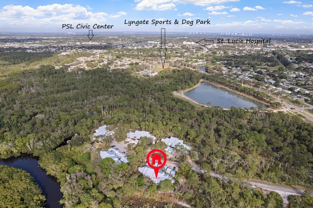 1820 SE Hideaway Cir Unit 1820, Port Saint Lucie, FL 34952 - birds eye view of property with a water view and a view of trees