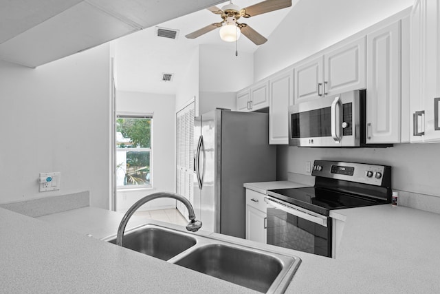 1820 SE Hideaway Cir Unit 1820, Port Saint Lucie, FL 34952 - kitchen featuring a sink, white cabinets, appliances with stainless steel finishes, and visible vents