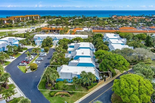 aerial view featuring a water view and a residential view