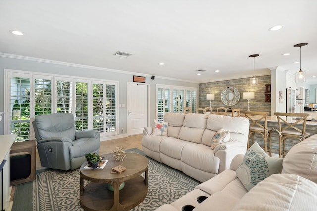 living room with ornamental molding, recessed lighting, and visible vents