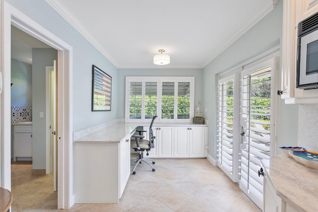 home office featuring crown molding and light tile patterned floors