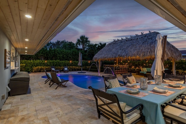 view of swimming pool featuring a fenced in pool, outdoor dining area, a patio area, and a gazebo