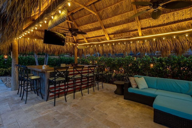view of patio / terrace with a gazebo, a ceiling fan, and outdoor lounge area