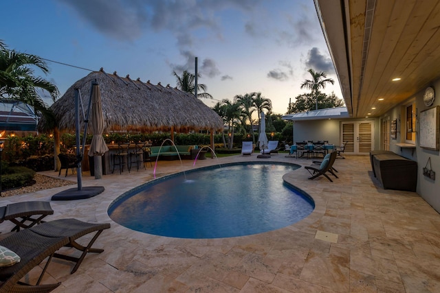pool featuring a patio area, french doors, and outdoor dry bar