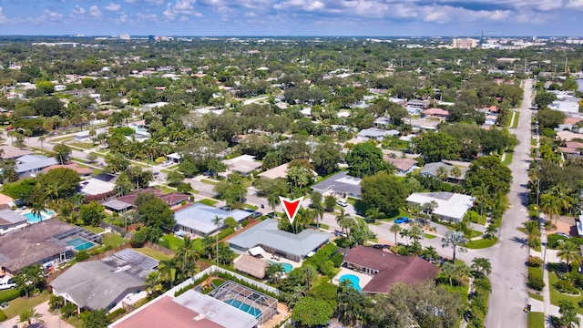 birds eye view of property with a residential view