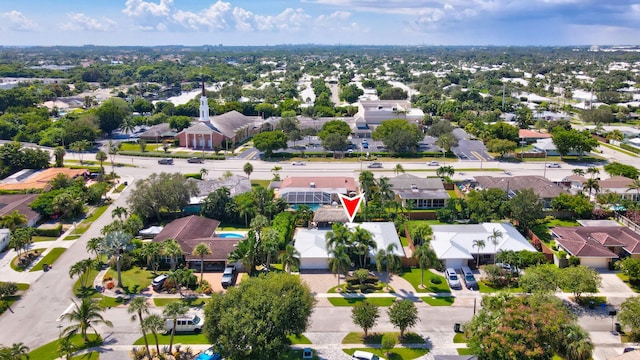 birds eye view of property with a residential view