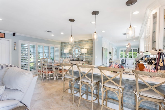 kitchen with crown molding, light tile patterned floors, recessed lighting, and visible vents
