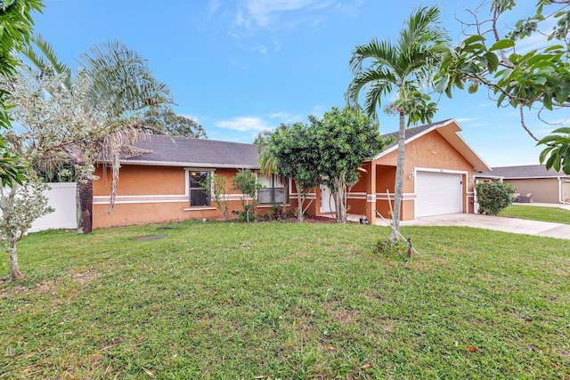 ranch-style house with a garage and a front lawn