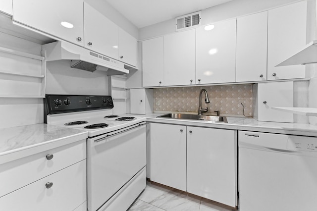 1024 Ellesmere B, Deerfield Beach, FL 33442 - kitchen with sink, white appliances, white cabinets, and decorative backsplash
