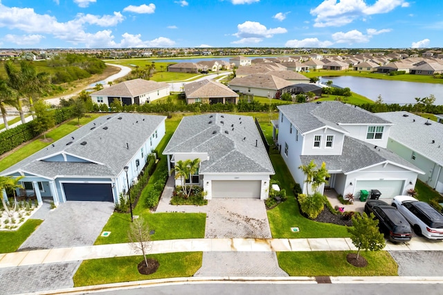 aerial view with a water view and a residential view