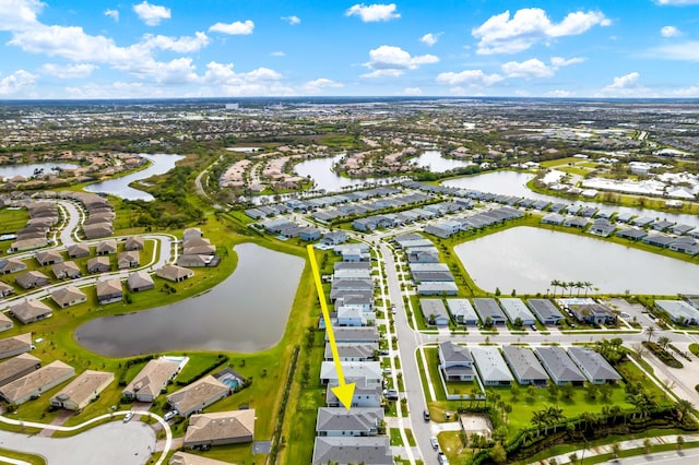 birds eye view of property featuring a water view and a residential view