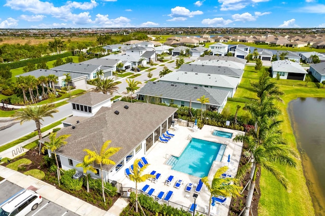 bird's eye view with a water view and a residential view