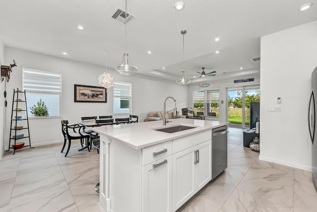 kitchen featuring stainless steel appliances, recessed lighting, visible vents, open floor plan, and a sink