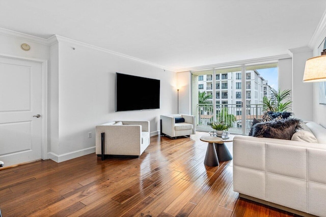 living room featuring a wall of windows, hardwood / wood-style flooring, and ornamental molding