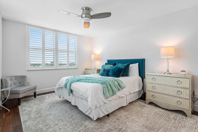 bedroom featuring hardwood / wood-style flooring and ceiling fan