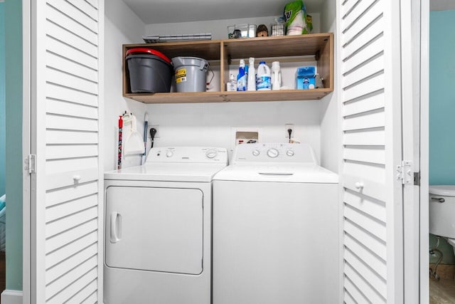 clothes washing area featuring washer and dryer