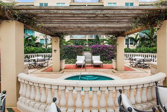 view of patio / terrace featuring a pergola and a community hot tub