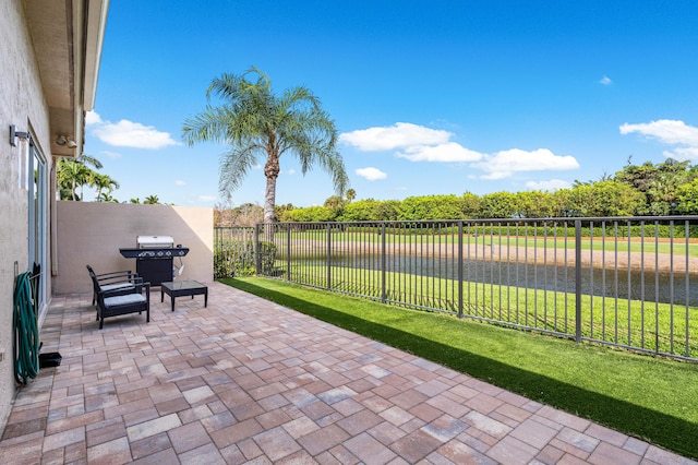 view of patio / terrace featuring a fenced backyard and grilling area