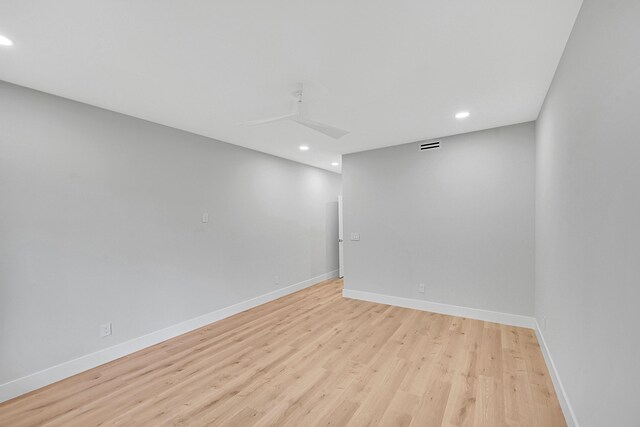 303 Sea Oats Dr Unit D, Juno Beach, FL 33408 - spare room featuring recessed lighting, light wood finished floors, and baseboards