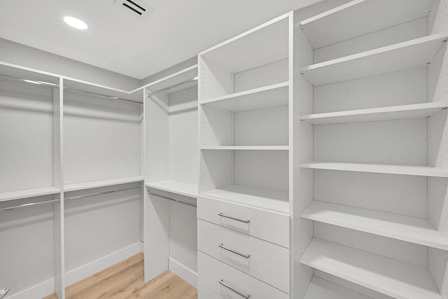 303 Sea Oats Dr Unit D, Juno Beach, FL 33408 - walk in closet featuring light wood-style flooring