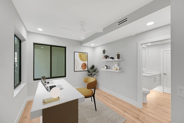 303 Sea Oats Dr Unit D, Juno Beach, FL 33408 - office area featuring a sink, light wood-type flooring, recessed lighting, and baseboards