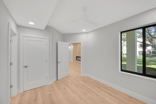 303 Sea Oats Dr Unit D, Juno Beach, FL 33408 - unfurnished bedroom featuring baseboards, light wood-type flooring, and recessed lighting