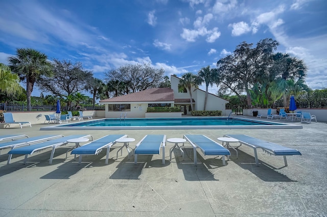 303 Sea Oats Dr Unit D, Juno Beach, FL 33408 - community pool with fence and a patio area