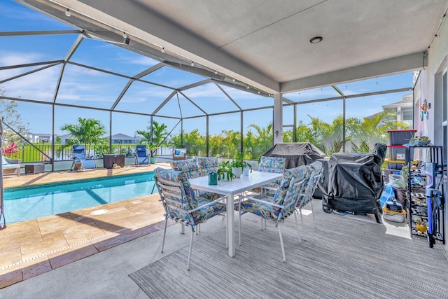 outdoor pool with a lanai and a patio