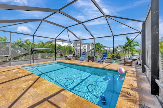 view of pool with a fenced in pool, a patio area, and glass enclosure