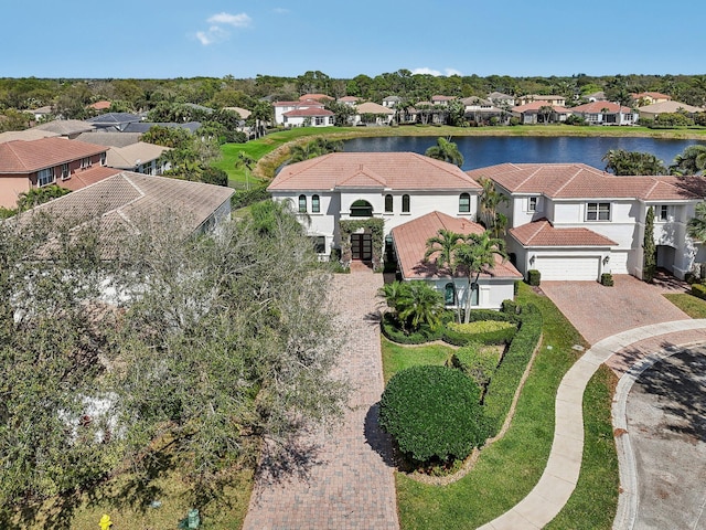 bird's eye view featuring a water view and a residential view