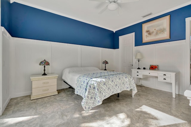 bedroom with ceiling fan and ornamental molding