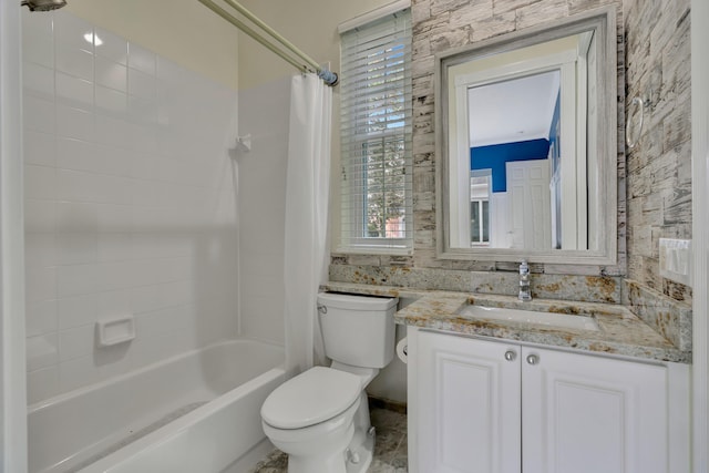 full bathroom with toilet, vanity, and shower / bathtub combination with curtain