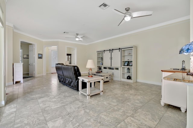 living room with ornamental molding and ceiling fan