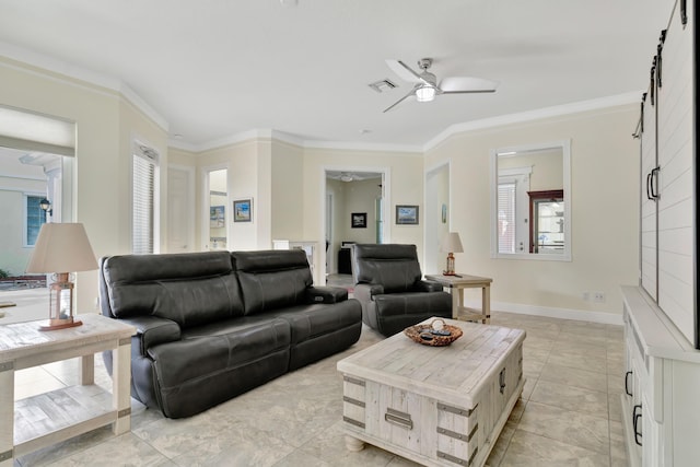 tiled living room with crown molding, ceiling fan, and a barn door